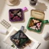 compact square pill organizer with carry loop